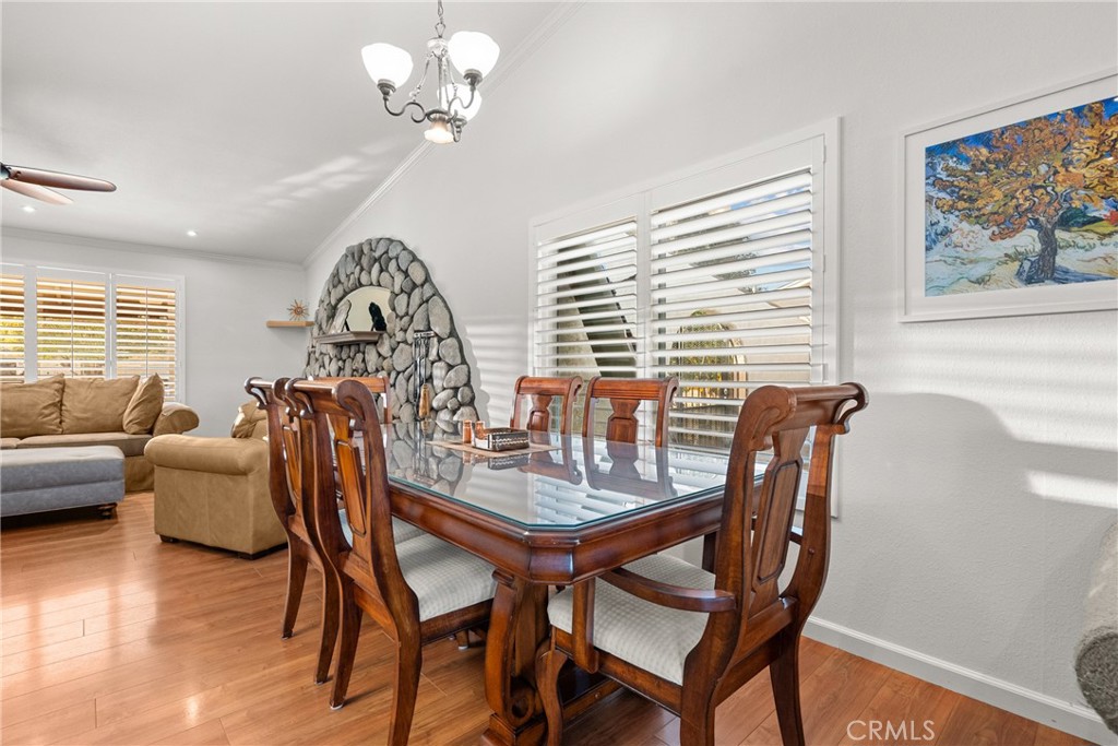 31436 Arrow Point Drive Castaic, CA 91384 - Photo 23 of 76 a view of a dining room with furniture window and wooden floor