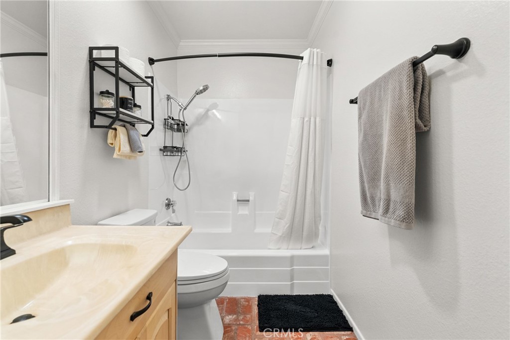 31436 Arrow Point Drive Castaic, CA 91384 - Photo 36 of 76 a bathroom with a sink a toilet and shower