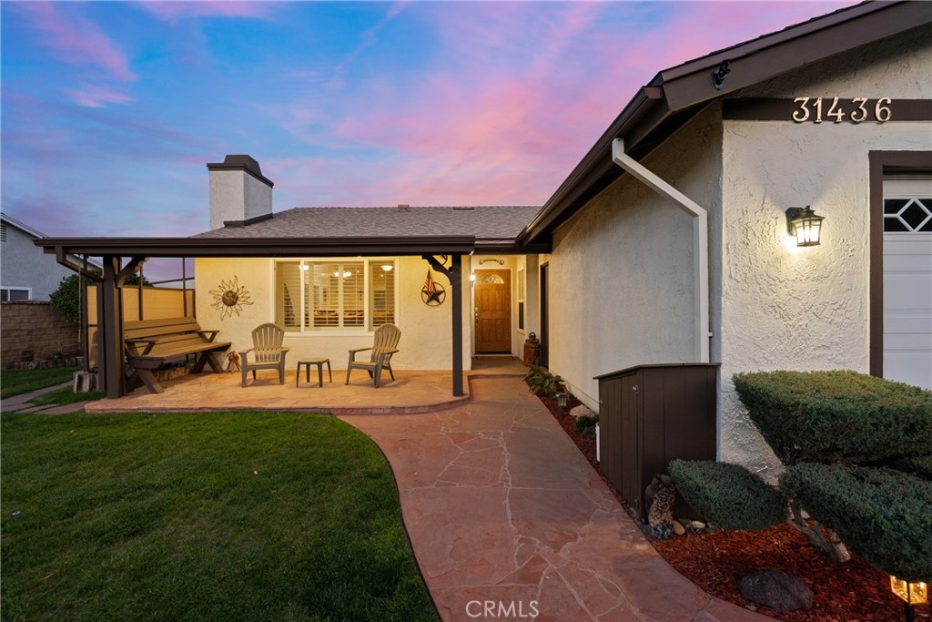 31436 Arrow Point Drive Castaic, CA 91384 - Photo 3 of 76 a front view of a house with patio