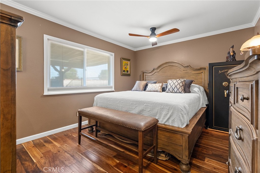31436 Arrow Point Drive Castaic, CA 91384 - Photo 43 of 76 a bedroom with a bed and wooden floor