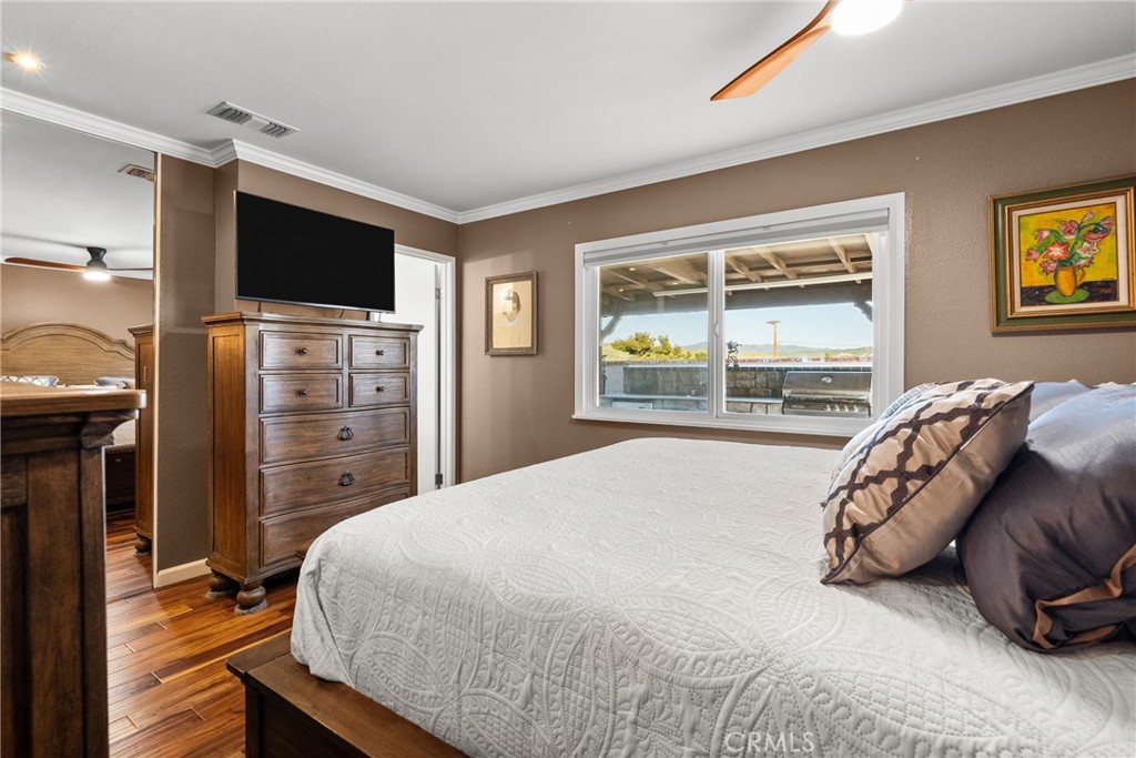 31436 Arrow Point Drive Castaic, CA 91384 - Photo 45 of 76 a bedroom with a bed and a flat screen tv