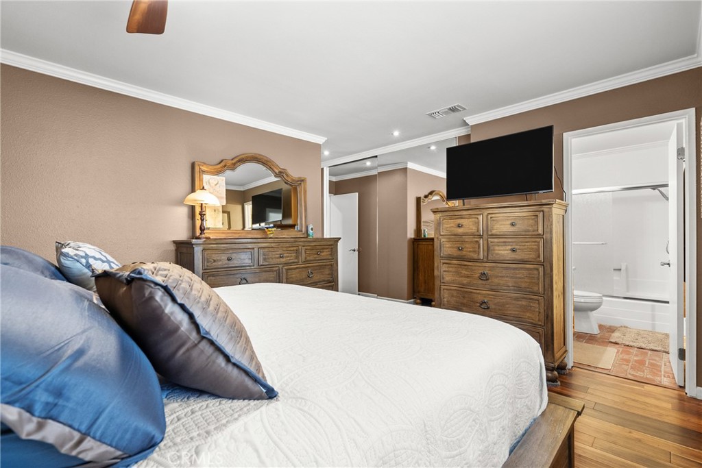 31436 Arrow Point Drive Castaic, CA 91384 - Photo 47 of 76 a bedroom with a bed and a flat screen tv