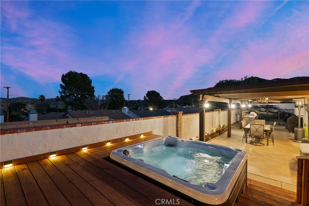 31436 Arrow Point Drive Castaic, CA 91384 - Photo 54 of 76 a view of a swimming pool with a table and chairs