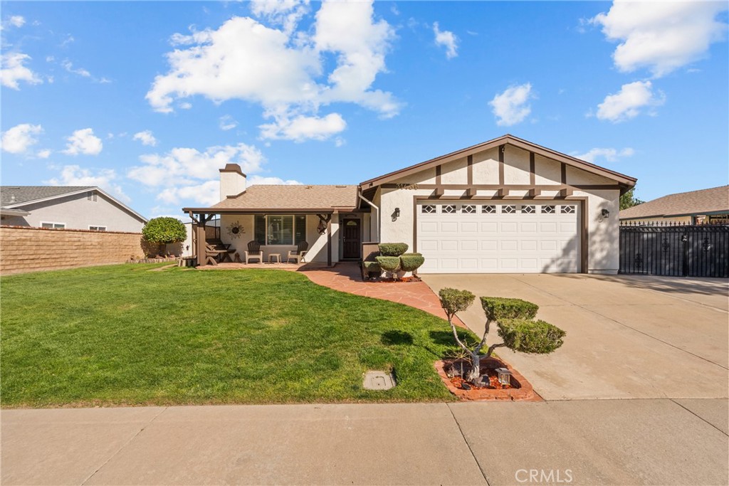 31436 Arrow Point Drive Castaic, CA 91384 - Photo 9 of 76 a front view of a house with a garden