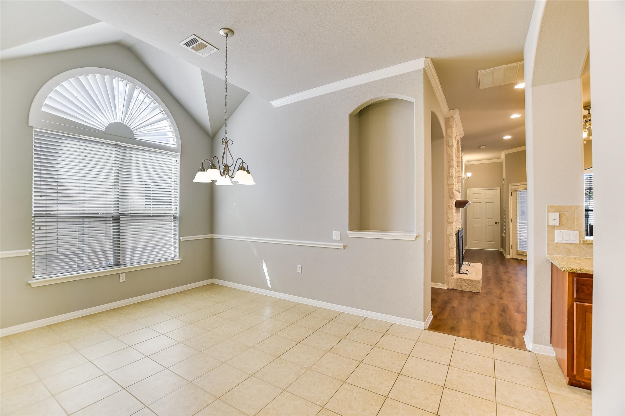 14100 Avery Ranch Boulevard, Unit 1101 Austin, TX 78717 - Photo 7 of 25 Unfurnished dining area with light tile patterned floors, a chandelier, and ornamental molding