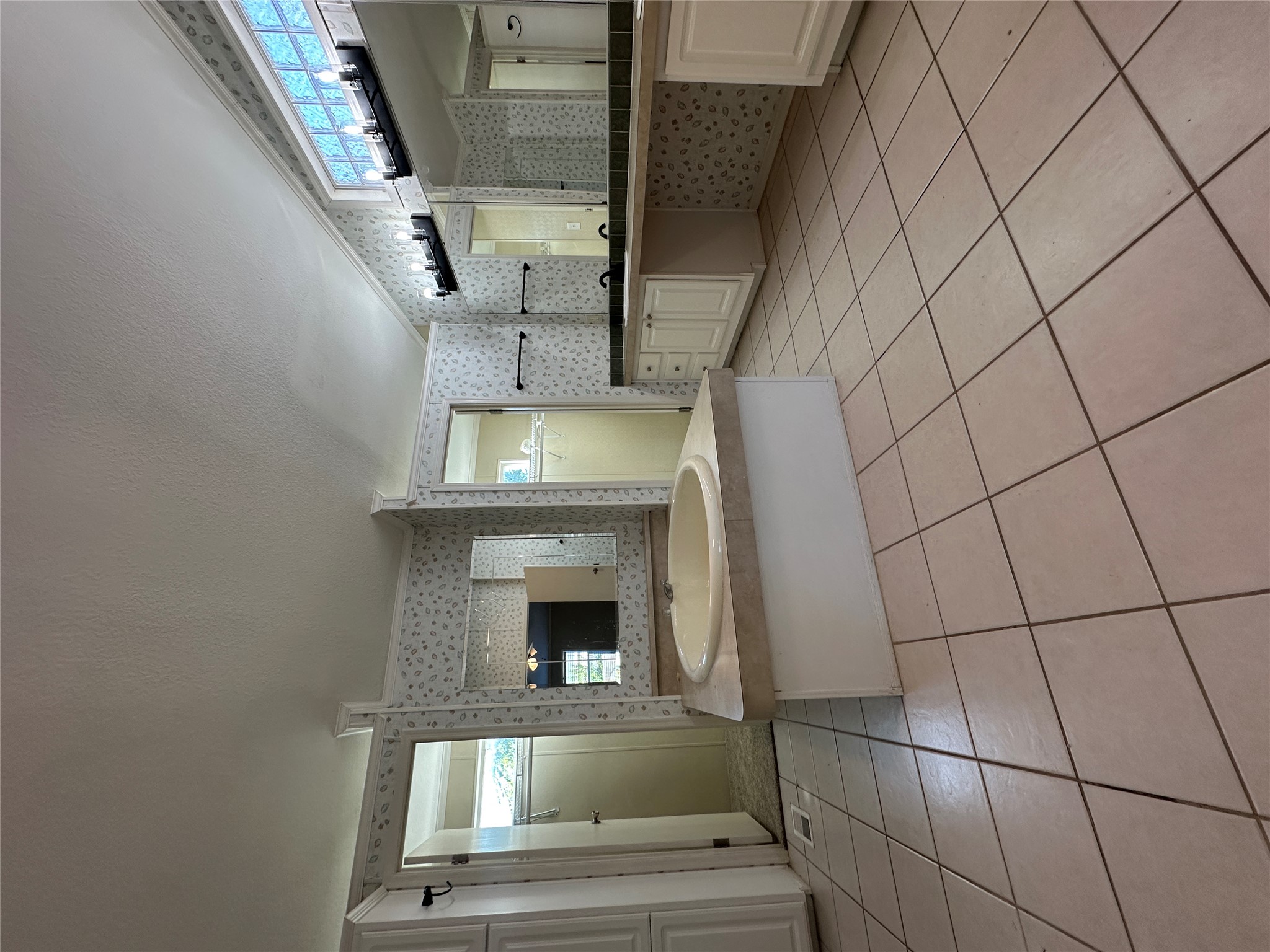 104 Ramirez Street Kyle, TX 78640 - Photo 14 of 31 a large white kitchen with a sink and cabinets