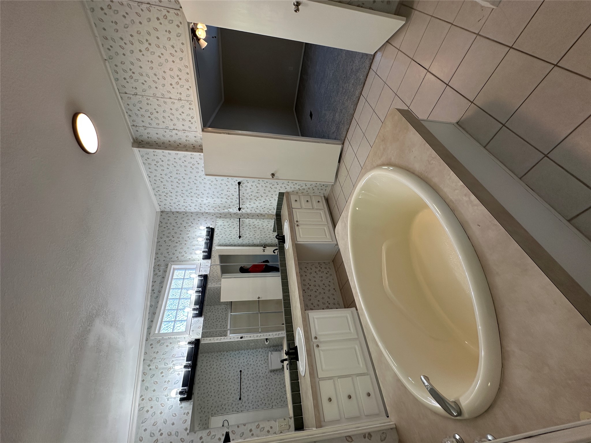 104 Ramirez Street Kyle, TX 78640 - Photo 16 of 31 a white bath tub sitting in a kitchen