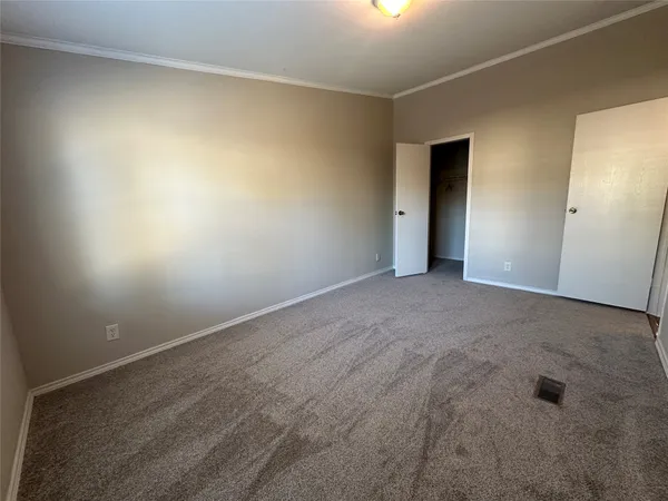 a view of a livingroom with a chandelier fan