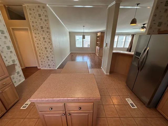 a view of an entryway with kitchen