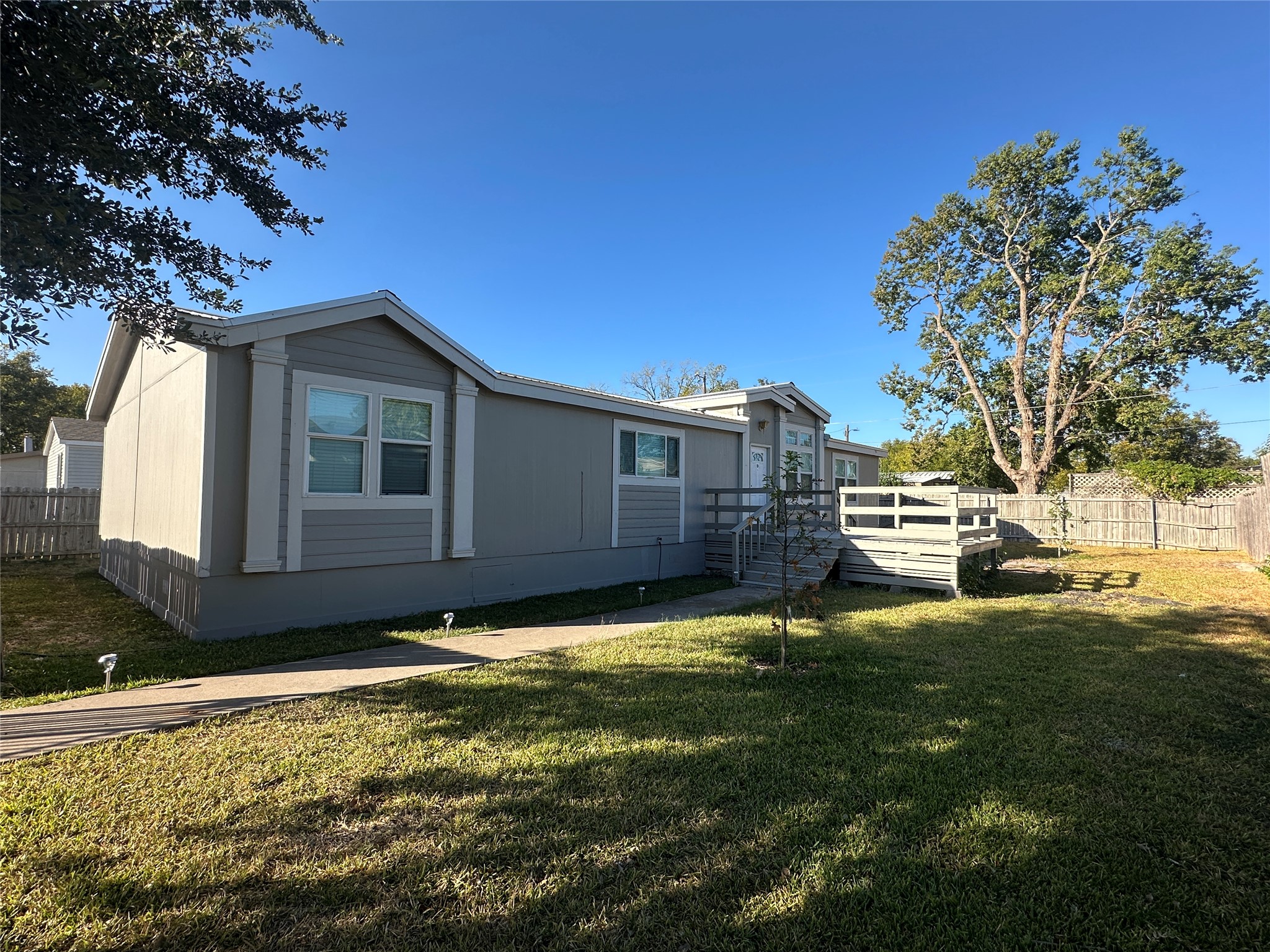 104 Ramirez Street Kyle, TX 78640 - Photo 6 of 31 a view of a house with a yard