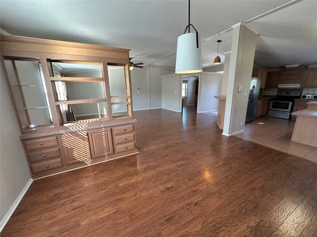 a view of a living room and hardwood floor