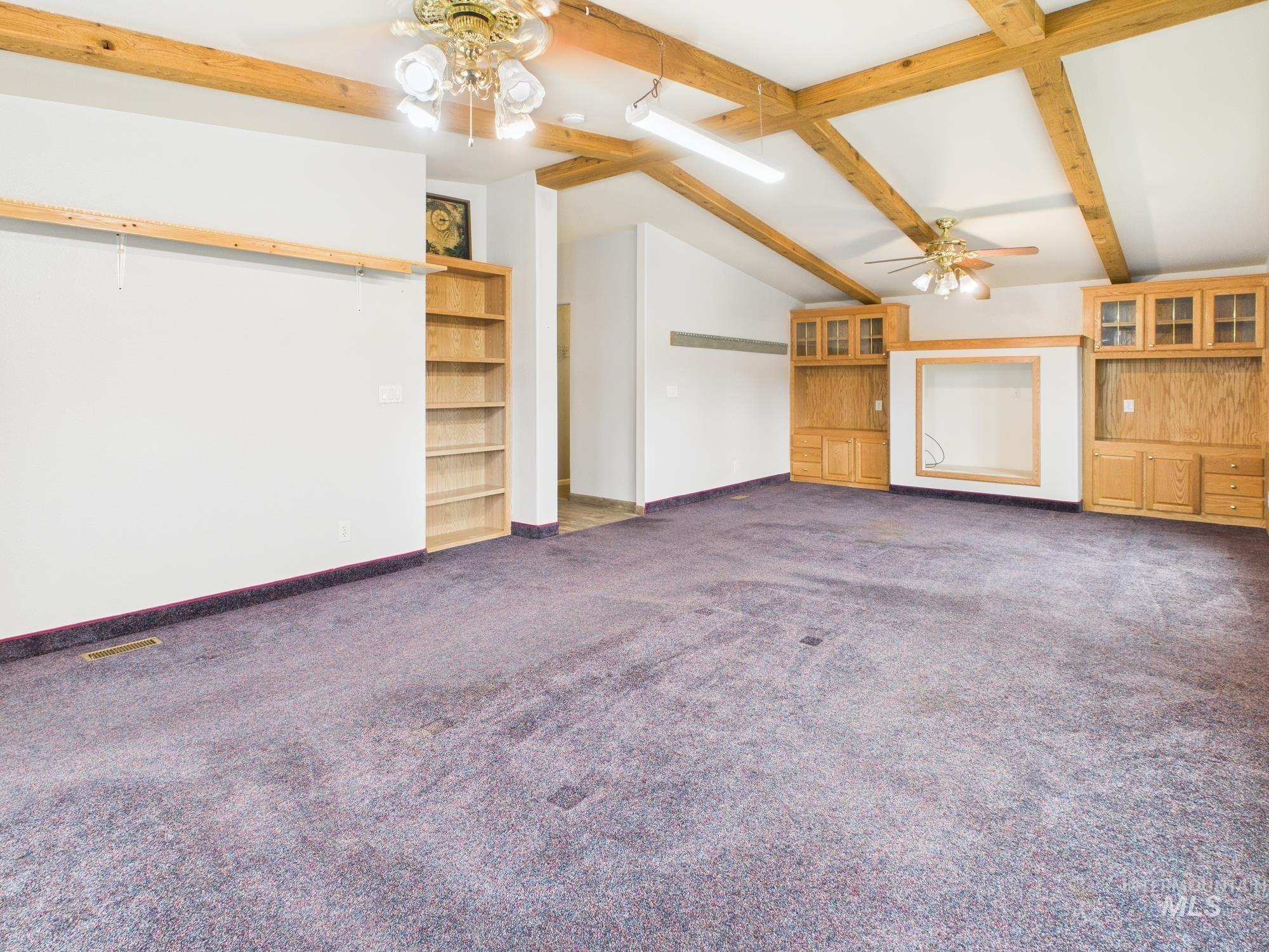 523 3rd Street Ferdinand, ID 83526 - Photo 22 of 41 large den with beautiful custom built in shelving.