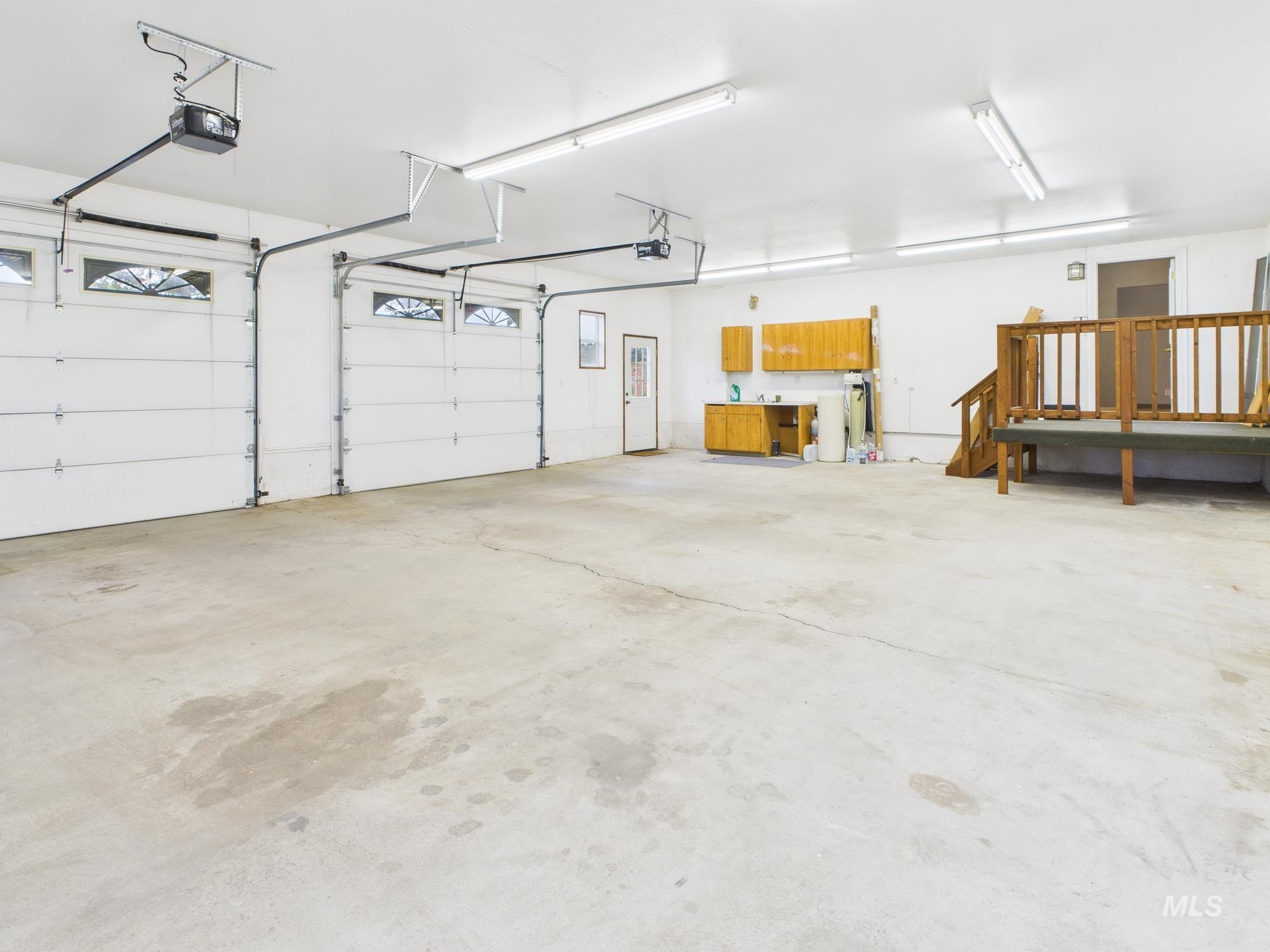 523 3rd Street Ferdinand, ID 83526 - Photo 26 of 41 Garage featuring a garage door opener