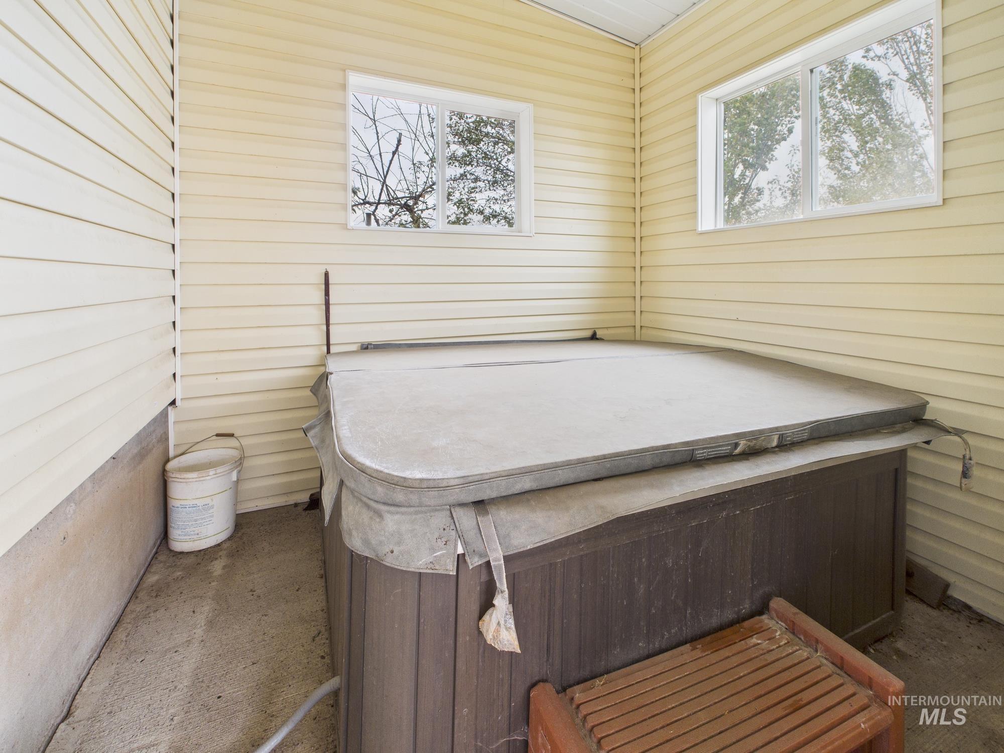 523 3rd Street Ferdinand, ID 83526 - Photo 28 of 41 Miscellaneous room featuring a hot tub and wood walls