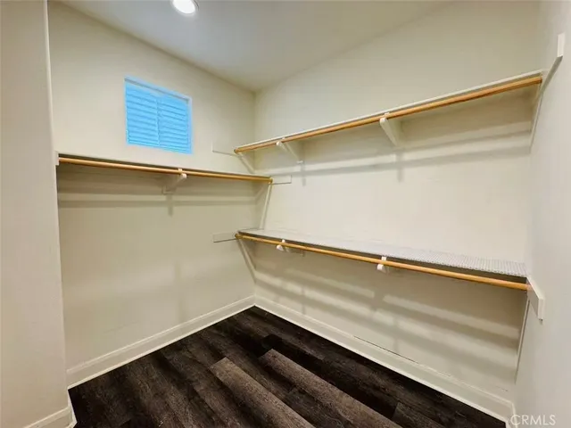 a bathroom with a double vanity sink mirror and shower