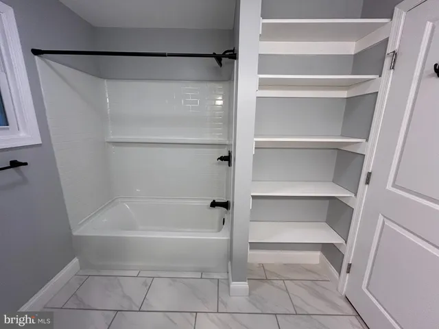 a bathroom with a bathtub