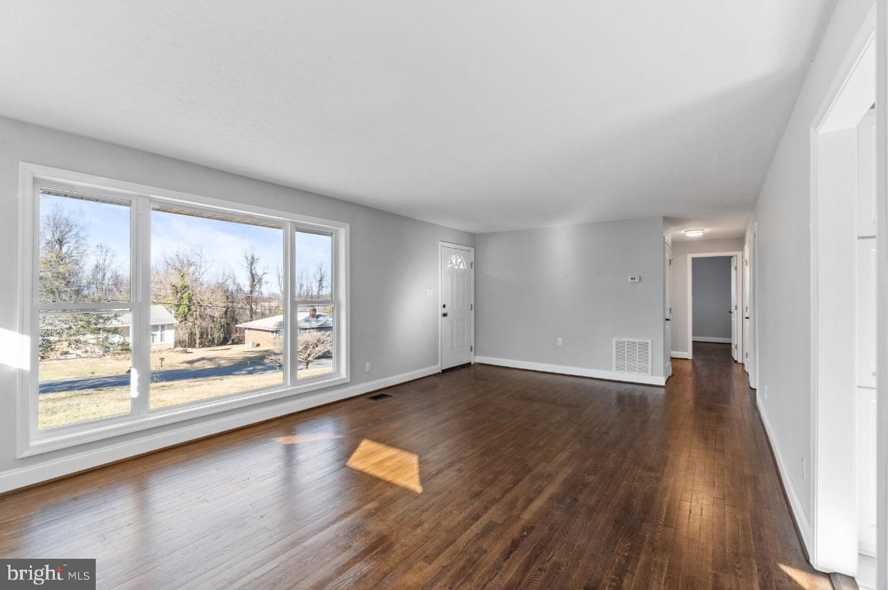 354 Berry Street Orange, VA 22960 - Photo 22 of 31 wooden floor in an empty room with a window