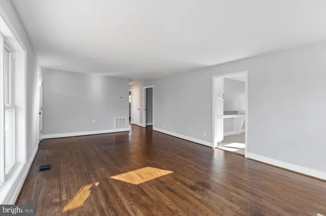 a view of a livingroom with wooden floor