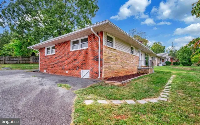 a backyard of a house with lots of green space