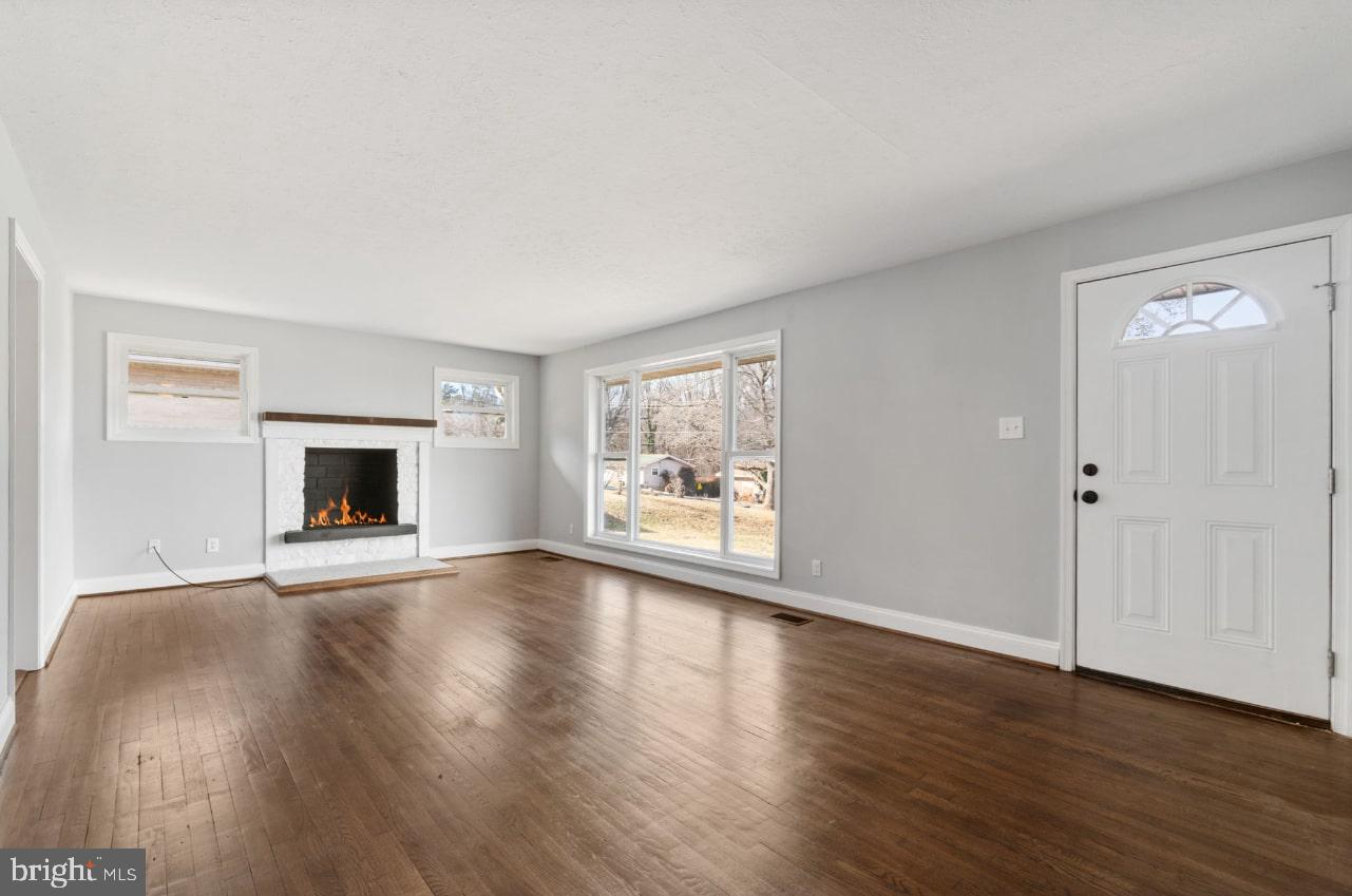 354 Berry Street Orange, VA 22960 - Photo 3 of 31 an empty room with wooden floor and windows