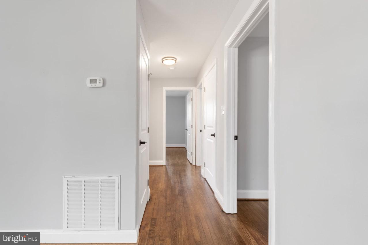 354 Berry Street Orange, VA 22960 - Photo 9 of 31 a view of a hallway with wooden floor
