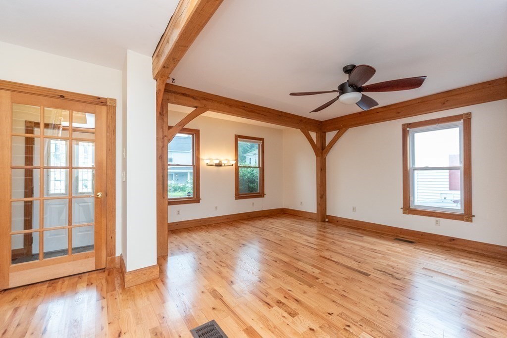 28 Branch Street Clinton, MA 01510 - Photo 13 of 30 a view of empty room with wooden floor and fan
