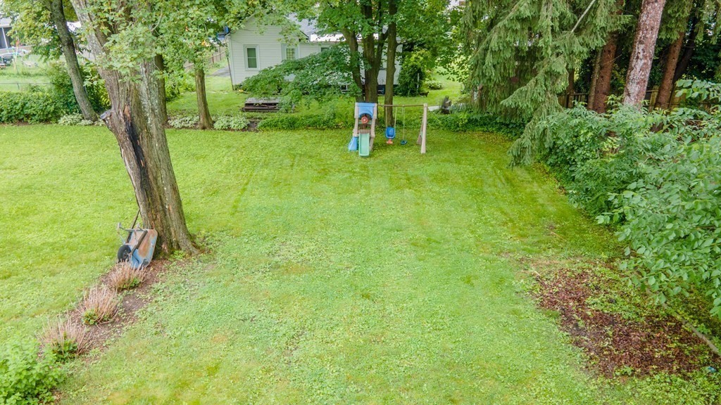 28 Branch Street Clinton, MA 01510 - Photo 26 of 30 a backyard of a house with table and chairs