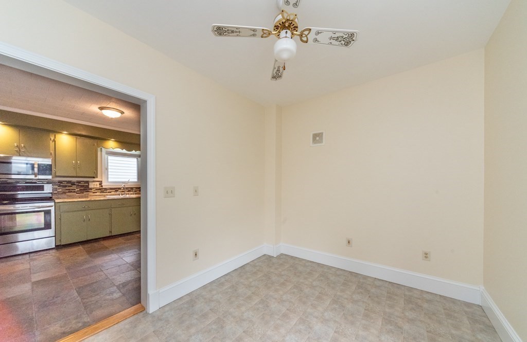 28 Branch Street Clinton, MA 01510 - Photo 7 of 30 a view of a kitchen with a refrigerator a stove top oven a sink and dishwasher