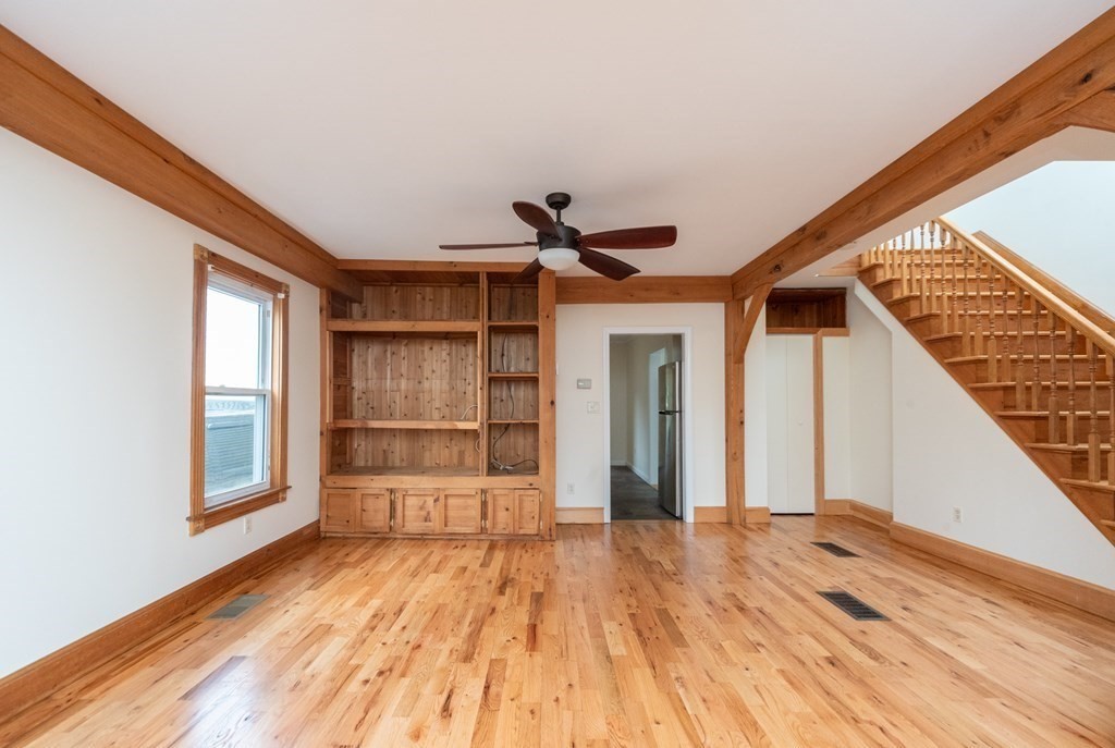 28 Branch Street Clinton, MA 01510 - Photo 10 of 30 a view of empty room with wooden floor and windows