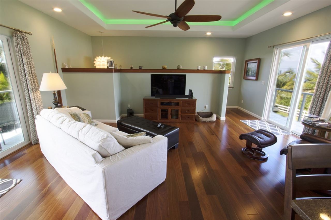 81 North Holokai Road Haiku, HI 96708 - Photo 11 of 30 a living room with furniture flat screen tv and a large window