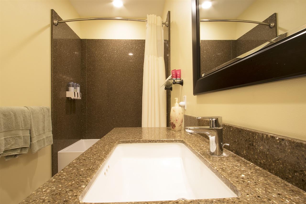 81 North Holokai Road Haiku, HI 96708 - Photo 19 of 30 a bathroom with a granite countertop shower and a sink