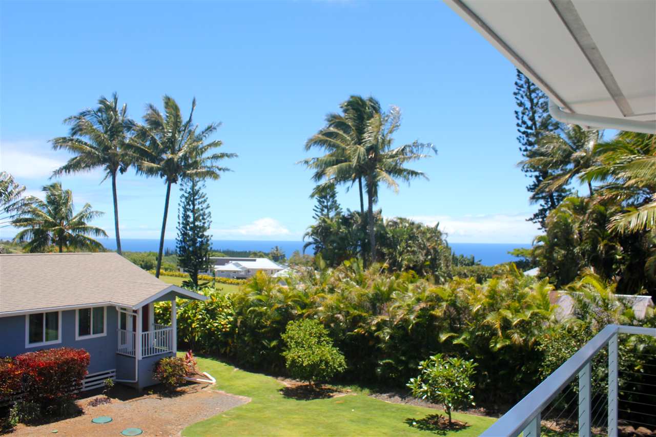 81 North Holokai Road Haiku, HI 96708 - Photo 2 of 30 a front view of a house with a yard and garage