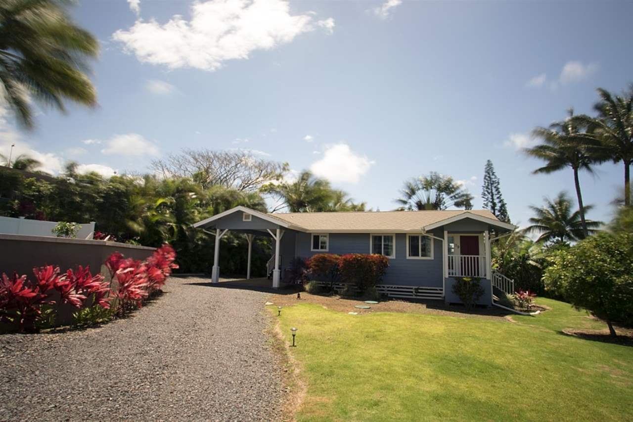 81 North Holokai Road Haiku, HI 96708 - Photo 23 of 30 a front view of a house with a yard and garage