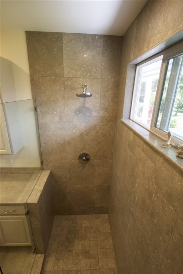 81 North Holokai Road Haiku, HI 96708 - Photo 7 of 30 a bathroom with a granite countertop sink a mirror and a shower