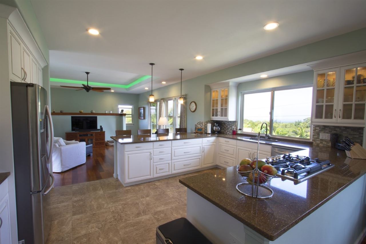 81 North Holokai Road Haiku, HI 96708 - Photo 9 of 30 a large living room with kitchen island furniture and a large window