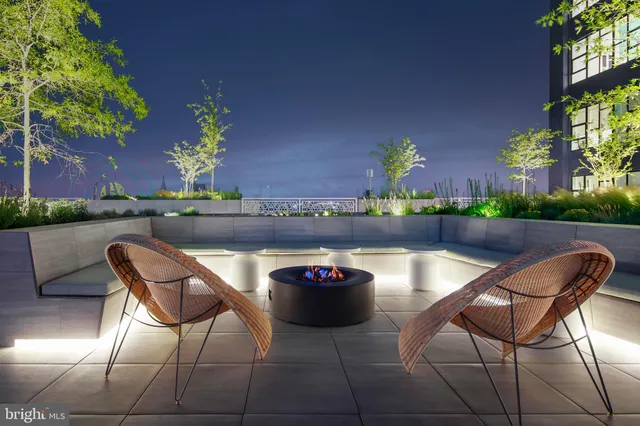 a view of swimming pool with sitting area