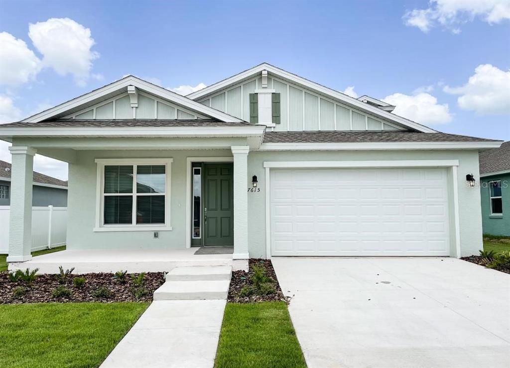 7615 Southwest 65th Pl Road Ocala, FL 34474 - Photo 1 of 1 a front view of a house with a yard