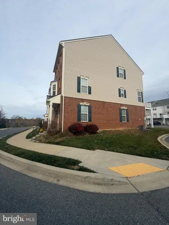 a view of a house with a yard and garage