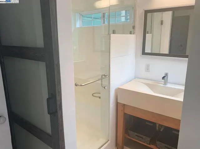 a bathroom with a sink and a mirror