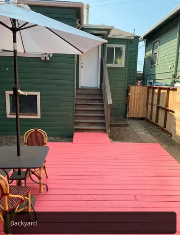 a backyard of a house with seating space