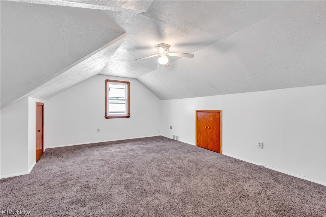 5731 Dunham Road Maple Heights, OH 44137 - Photo 19 of 28 Second floor bedroom featuring carpet, and vaulted ceiling