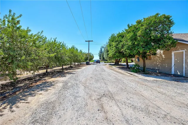 a view of a road with a building in the background