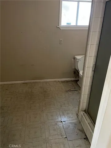 a bathroom with a toilet and a sink