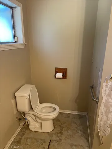 a bathroom with a toilet and a sink