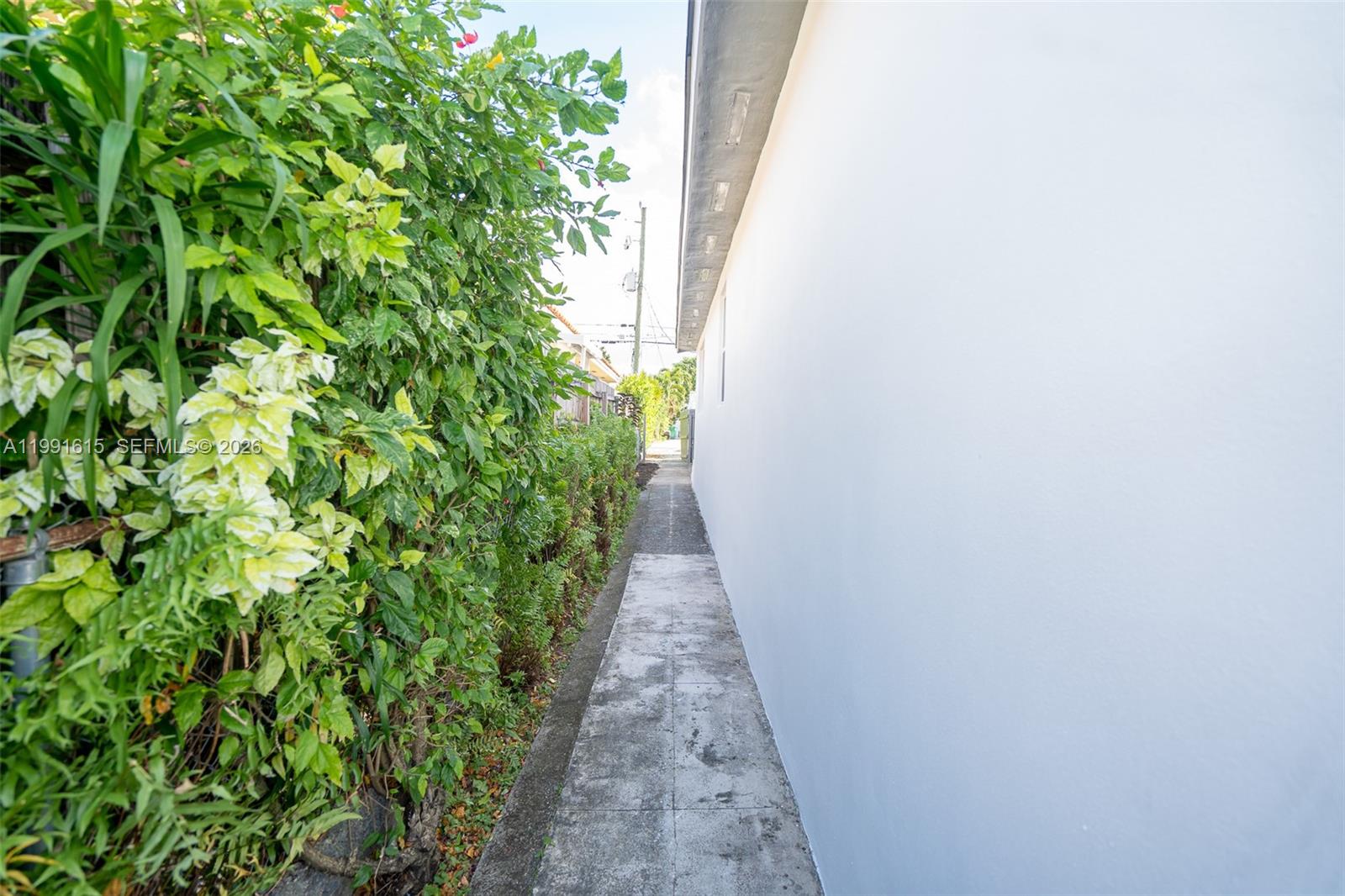 2230 Southwest 60th Court Miami, FL 33155 - Photo 15 of 35 a view of a pathway with plants