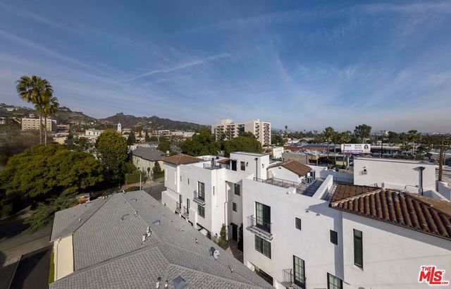 a view of city with ocean