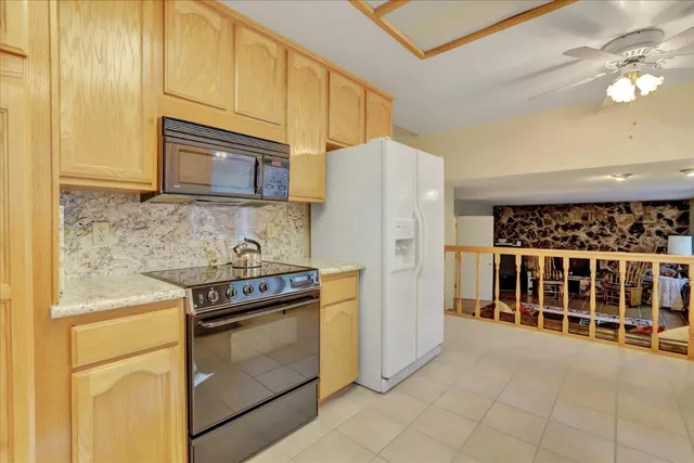 a living room with couch and a rug