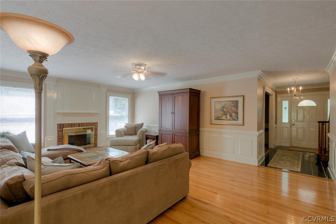 9211 Cattail Road Chesterfield, VA 23838 - Photo 12 of 37 a living room with furniture and a fireplace