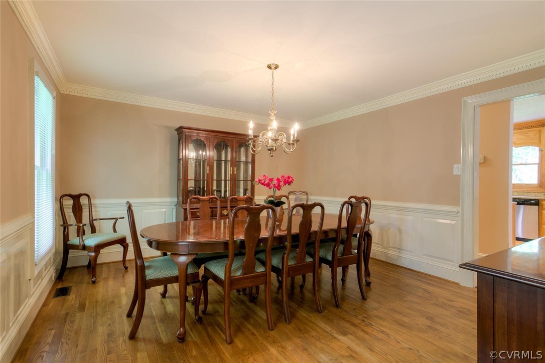 9211 Cattail Road Chesterfield, VA 23838 - Photo 14 of 37 a view of a dining room with furniture window and wooden floor