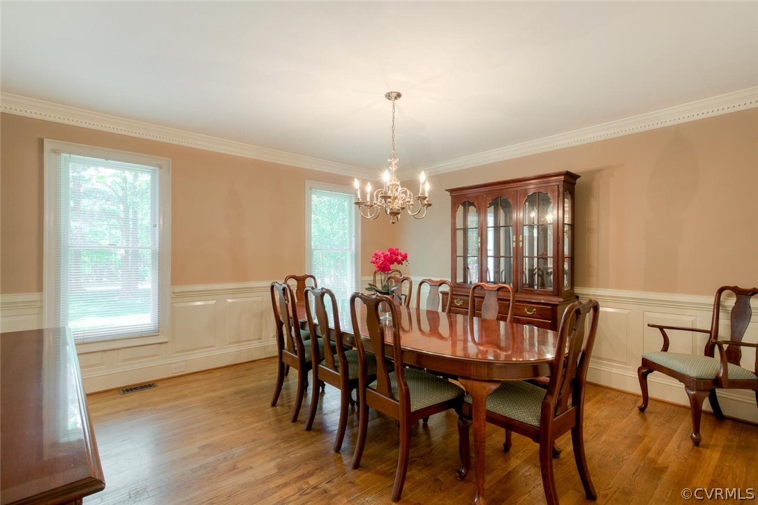 9211 Cattail Road Chesterfield, VA 23838 - Photo 15 of 37 a view of a dining room with furniture window and wooden floor